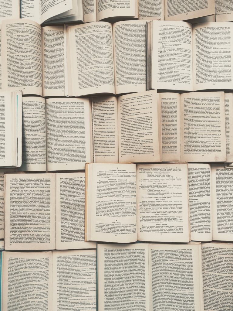 Vertically arranged open books creating a textured pattern, ideal for educational themes.
